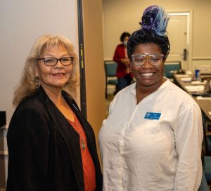 two pw board members smiling