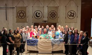 2024 CSW delegates around altar